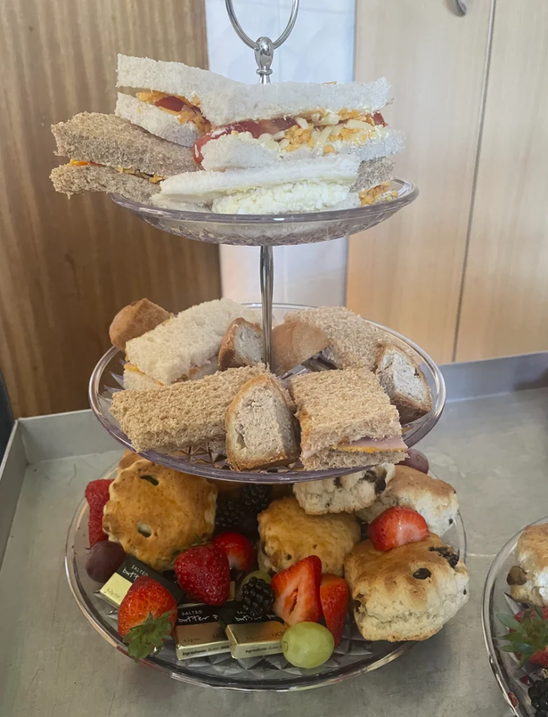 Afternoon tea stand with cakes and sandwiches